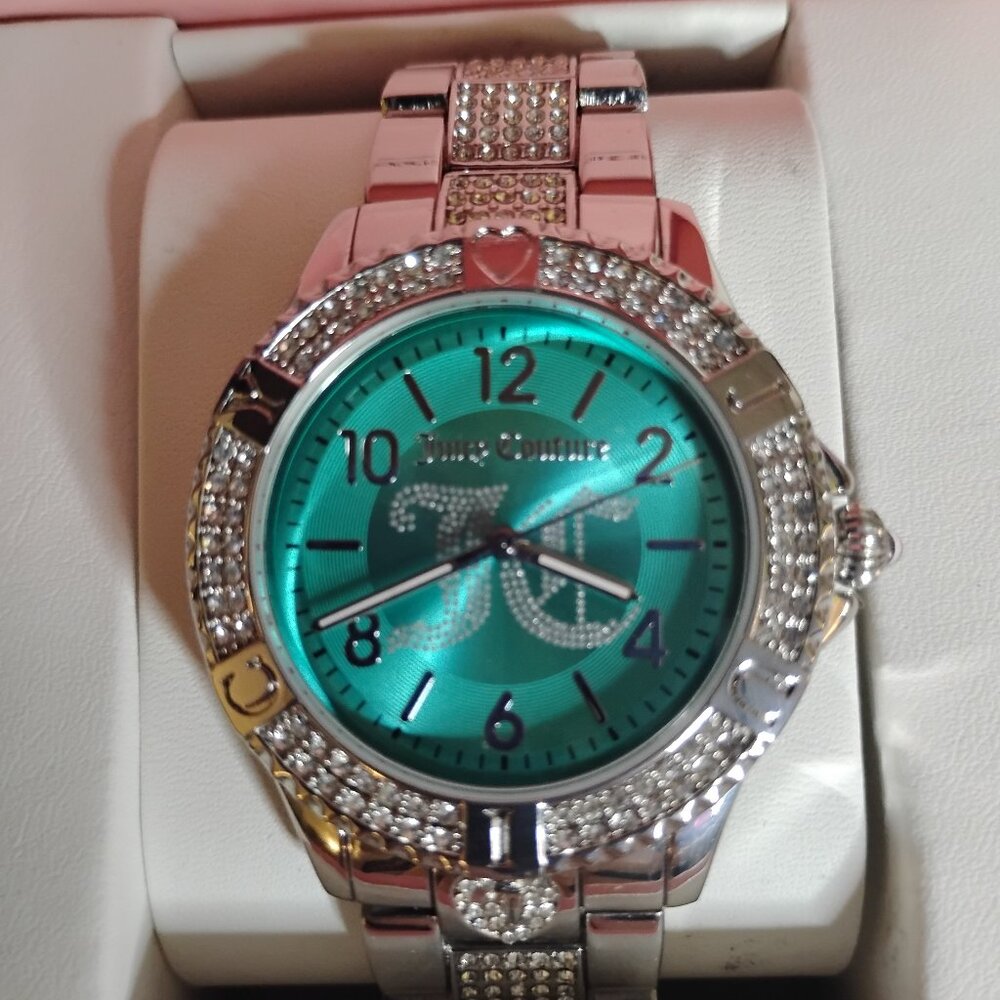 Juicy Couture JC/1384GNGN Teal Green Analog Wrist Watch featuring crystal bezel